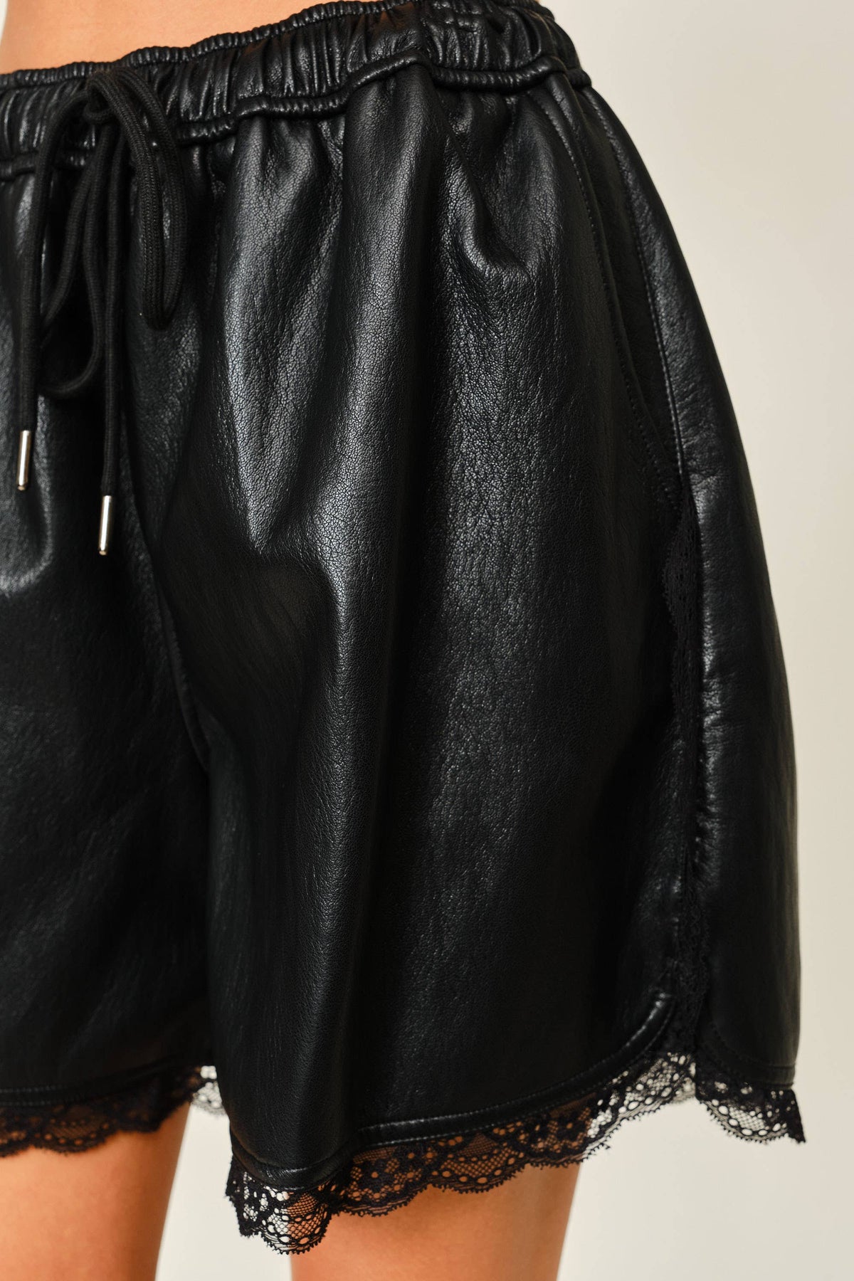 VEGAN LEATHER LACE TRIM SHORTS: BLACK